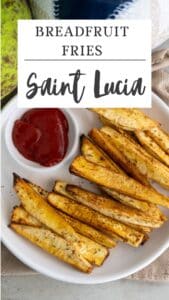 A plate of crispy breadfruit fries served with ketchup, labeled "Breadfruit Fries Saint Lucia.